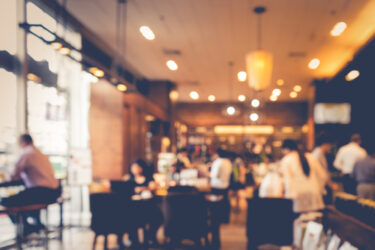 Blur coffee shop or cafe restaurant with abstract bokeh light image background
