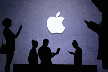 Apple American multinational technology company Group of business people chat on mobile phone and laptop.