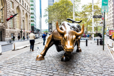 Wall Street stock exchange charging metal bull in NYC Manhattan lower financial district downtown NYSE