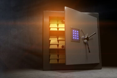 Some golden bars in a vault with an open door and a bluish glowing combination lock.