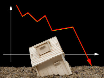 house sinking with a downward arrow on background